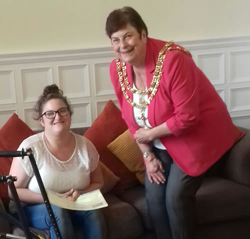 Photo showing Trustee and Young Leader Sammy Taylor receiving her certificate from Mayor Copeland