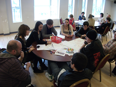 Photo of Young Leaders at a Forum event sitting around a table