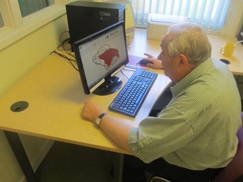Photo showing John working on computer art